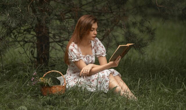 girl reading outside