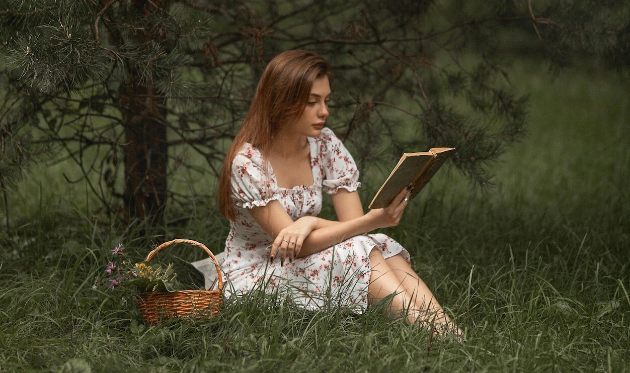 girl reading outside