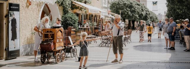 people standing still in a rustic street
